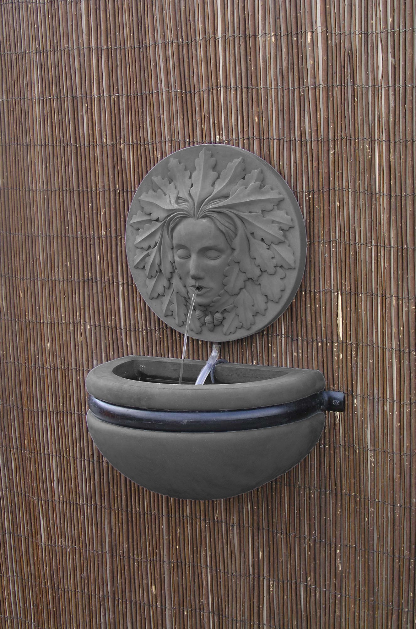 Grøn kvinde væg springvand