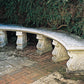 Classic stone bench with curved seat